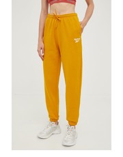 Spodnie spodnie dresowe damskie kolor pomarańczowy gładkie - Answear.com Reebok