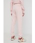 Spodnie New Balance spodnie dresowe damskie kolor różowy gładkie