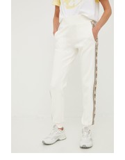 Spodnie spodnie dresowe damskie kolor beżowy z nadrukiem - Answear.com Guess