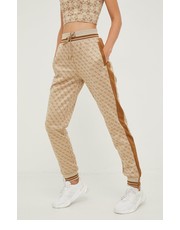 Spodnie spodnie dresowe damskie kolor beżowy wzorzyste - Answear.com Guess