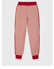 Spodnie spodnie dziecięce kolor czerwony wzorzyste - Answear.com Guess