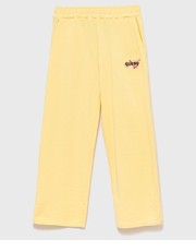 Spodnie spodnie dresowe dziecięce kolor żółty gładkie - Answear.com Guess