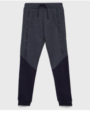 Spodnie spodnie dresowe dziecięce kolor granatowy z nadrukiem - Answear.com Guess