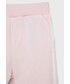 Spodnie Guess dres bawełniany dziecięcy kolor różowy