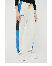 Spodnie spodnie dresowe damskie kolor beżowy wzorzyste - Answear.com Under Armour