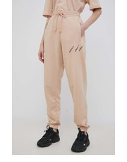 Spodnie spodnie damskie kolor beżowy z nadrukiem - Answear.com Adidas Originals