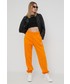 Spodnie Adidas Originals adidas Originals spodnie dresowe Adicolor damskie kolor pomarańczowy gładkie
