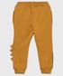 Spodnie Name It Name it spodnie dresowe dziecięce Park Jurajski kolor żółty z nadrukiem