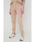 Spodnie Rip Curl spodnie dresowe damskie kolor beżowy z nadrukiem