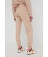 Spodnie Rip Curl spodnie dresowe damskie kolor beżowy z nadrukiem