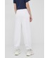 Spodnie Tommy Jeans spodnie bawełniane damskie kolor biały gładkie