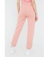 Spodnie Champion spodnie dresowe 114925 damskie kolor różowy gładkie