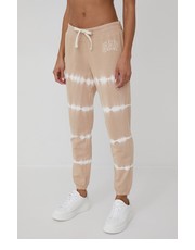 Spodnie spodnie dresowe damskie kolor beżowy z nadrukiem - Answear.com Gap