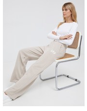 Spodnie spodnie dresowe damskie kolor beżowy z nadrukiem - Answear.com Gap