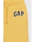 Spodnie Gap spodnie dziecięce kolor żółty z aplikacją