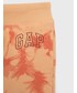Spodnie Gap spodnie dresowe dziecięce kolor pomarańczowy wzorzyste
