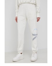 Spodnie Spodnie bawełniane damskie kolor beżowy z nadrukiem - Answear.com Calvin Klein Jeans