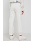 Spodnie Calvin Klein Jeans Spodnie bawełniane damskie kolor beżowy z nadrukiem