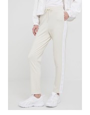 Spodnie spodnie dresowe damskie kolor beżowy z aplikacją - Answear.com Calvin Klein Jeans