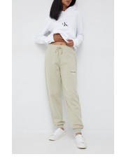 Spodnie spodnie dresowe damskie kolor beżowy gładkie - Answear.com Calvin Klein Jeans