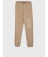 Spodnie Calvin Klein Jeans spodnie bawełniane dziecięce kolor beżowy z nadrukiem