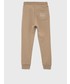Spodnie Calvin Klein Jeans spodnie bawełniane dziecięce kolor beżowy z nadrukiem